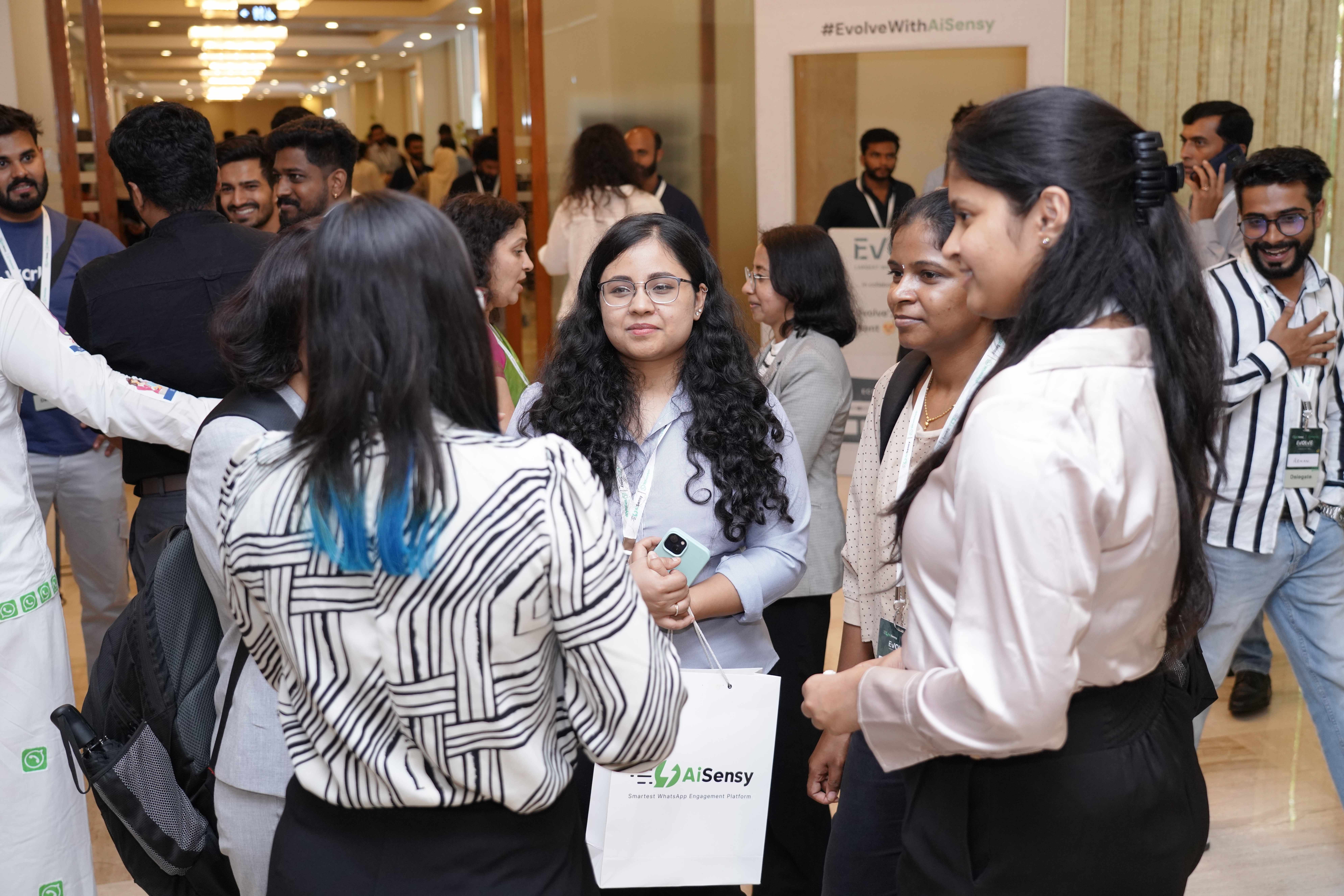 Networking session with attendees and AiSensy branded materials